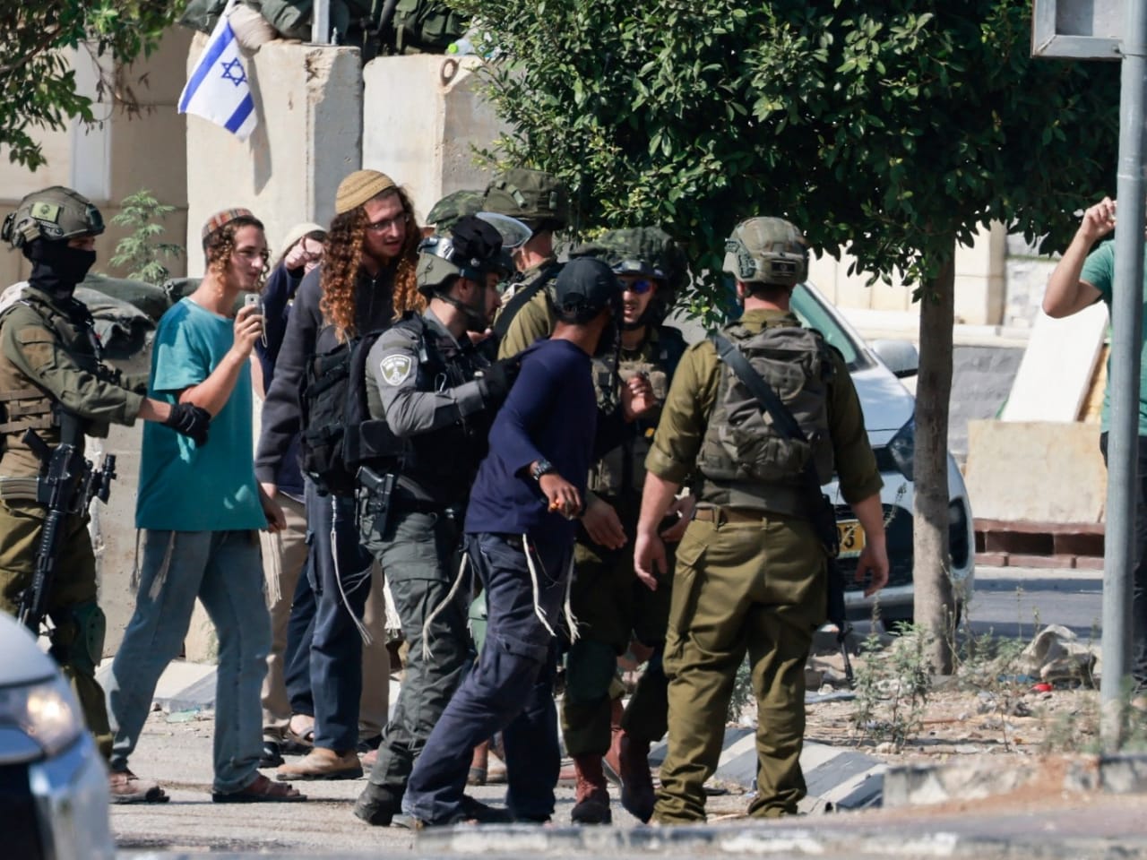 Dozens of Israeli settlers attack Israeli soldiers near West Bank town, 6 arrested