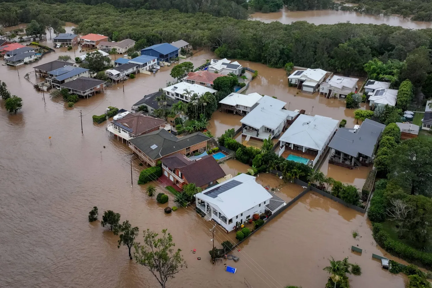 Torrential Rain Ravages Australian Towns, Thousands Brace for Isolation