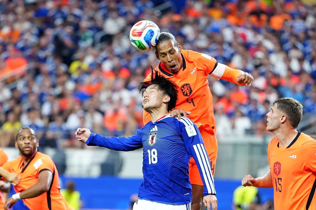 Japan rallies twice to draw with Netherlands at World Cup